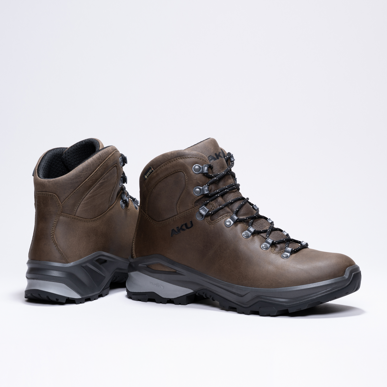 Durable brown hiking boots with black soles and secure lace-up design.
