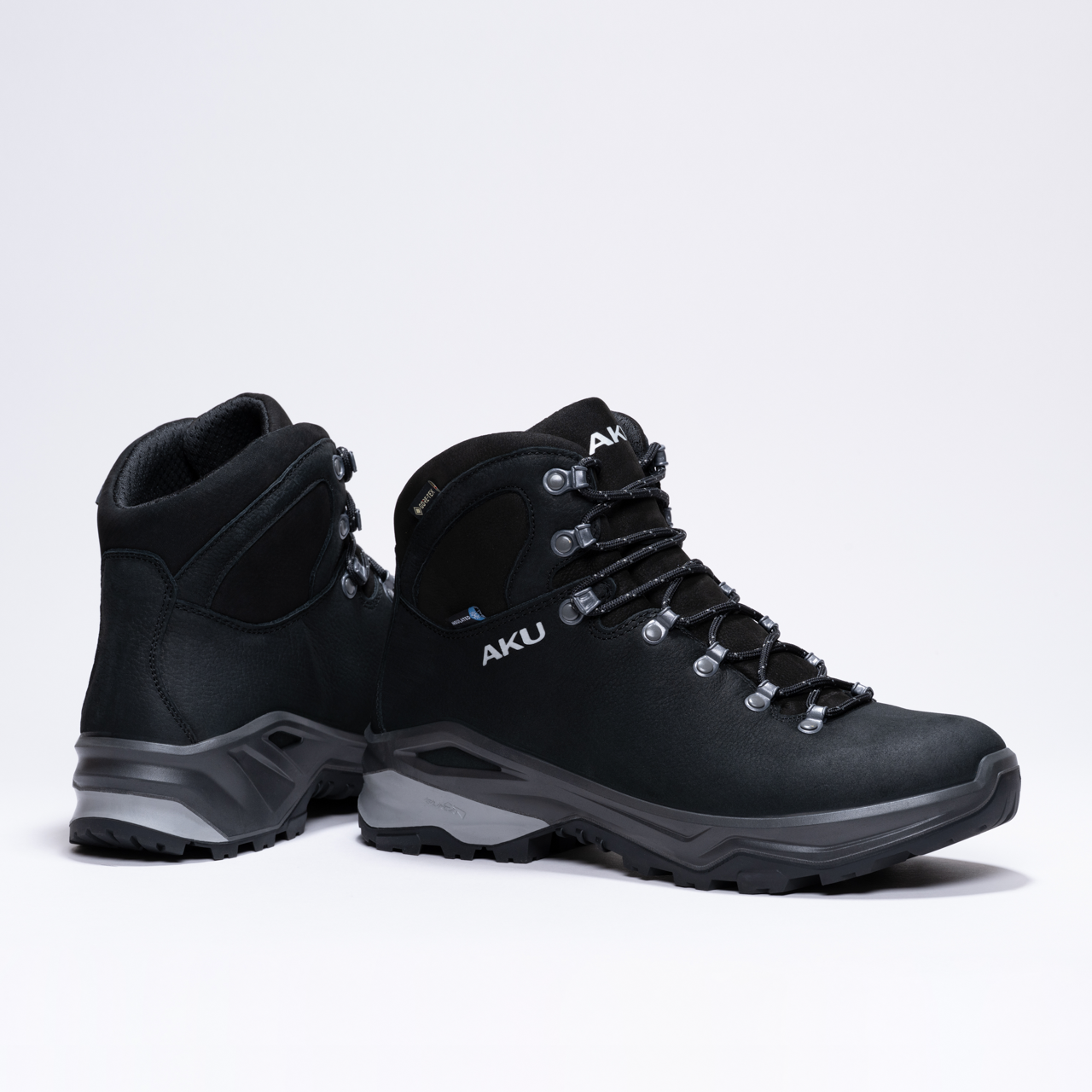 Black AKU hiking boots with sturdy soles and metal eyelets for laces.